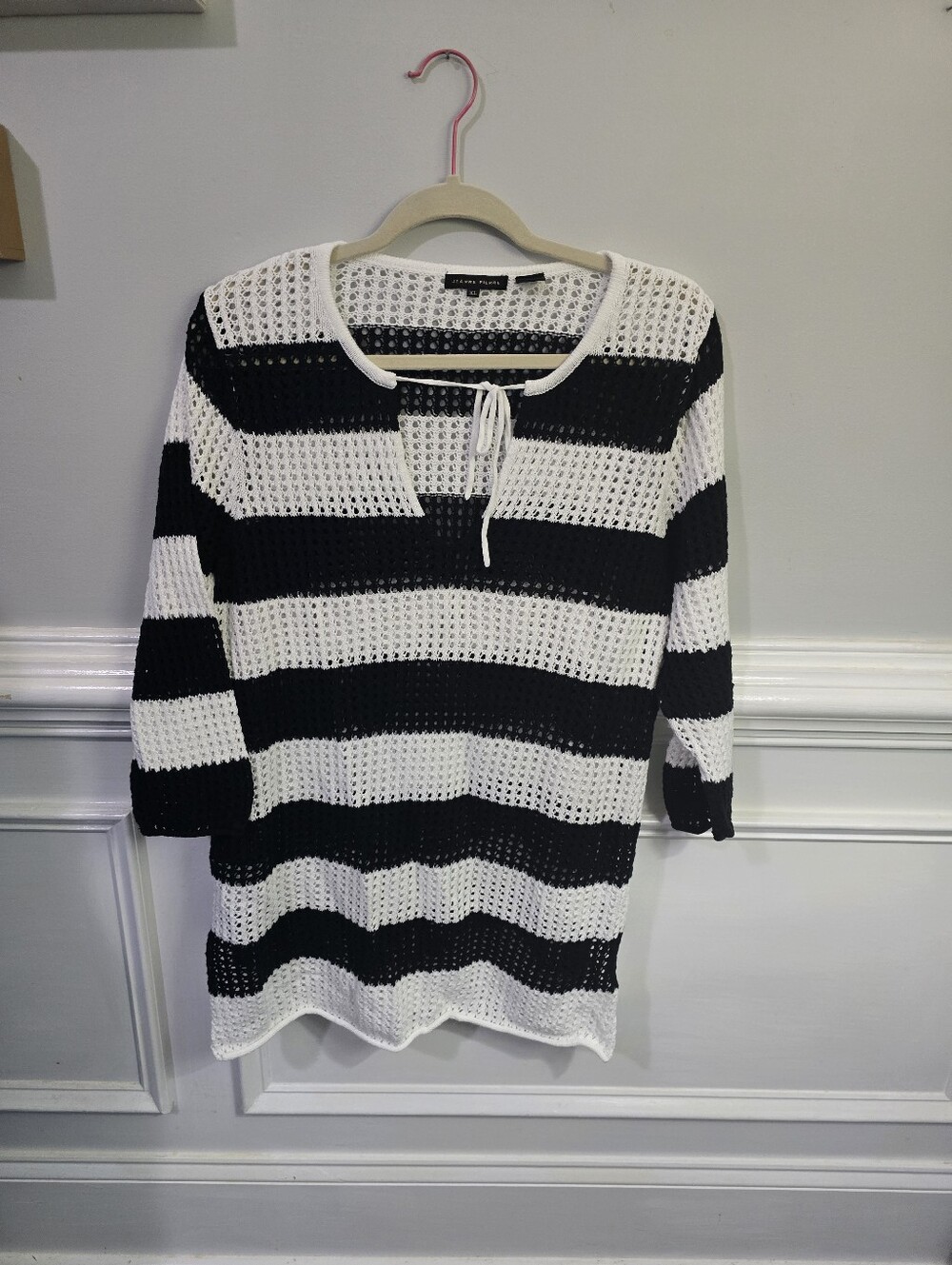 Stylish Jeanne Pierre open-knit sweater in classic black and white stripes.